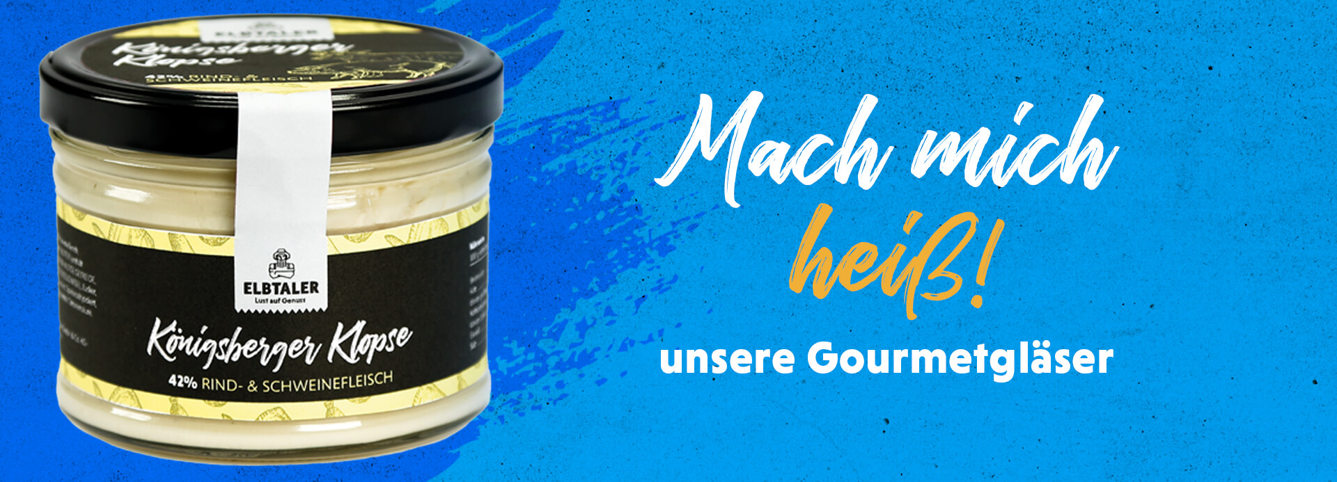 Gourmetglas Königsberger Klopse auf blauem Hintergrund. Auf dem Bild steht die Überschrift „Mach mich heiß! unsere Gourmetgläser“.